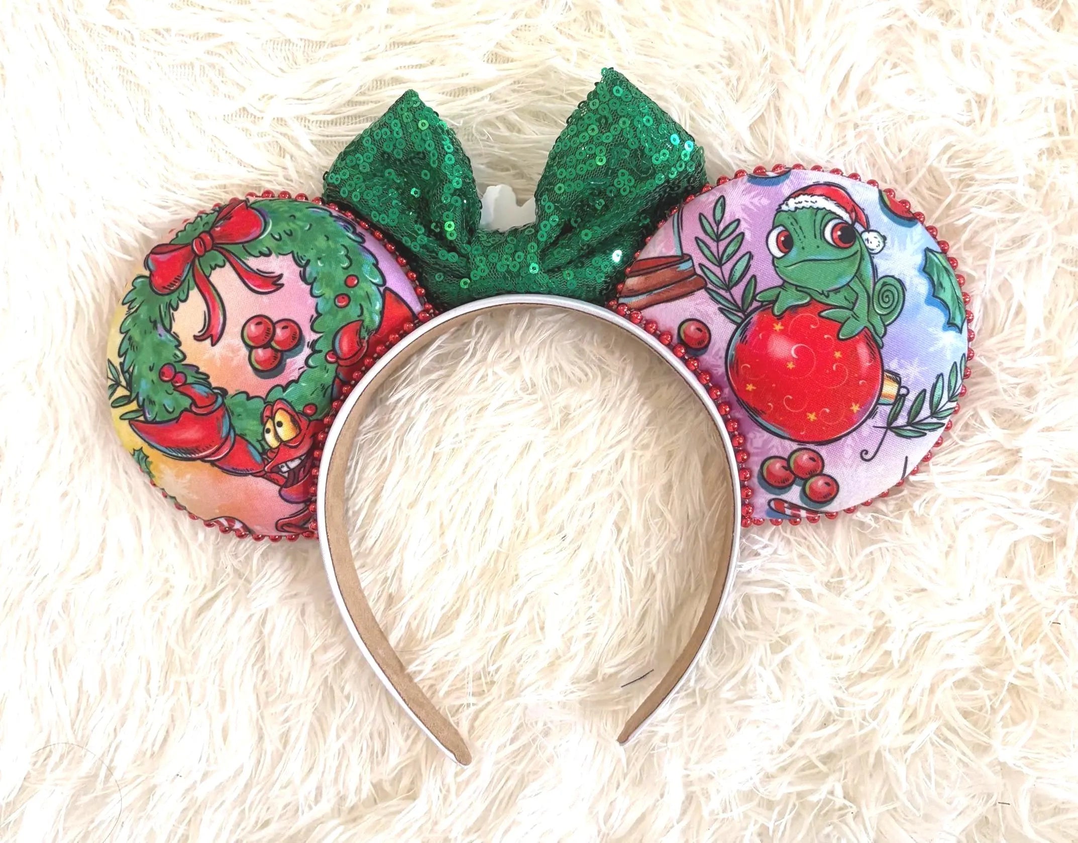 Holiday Magic Boutique Mouse Ear Headband featuring festive holiday artwork, an emerald green sequined bow, and handcrafted boutique detailing.