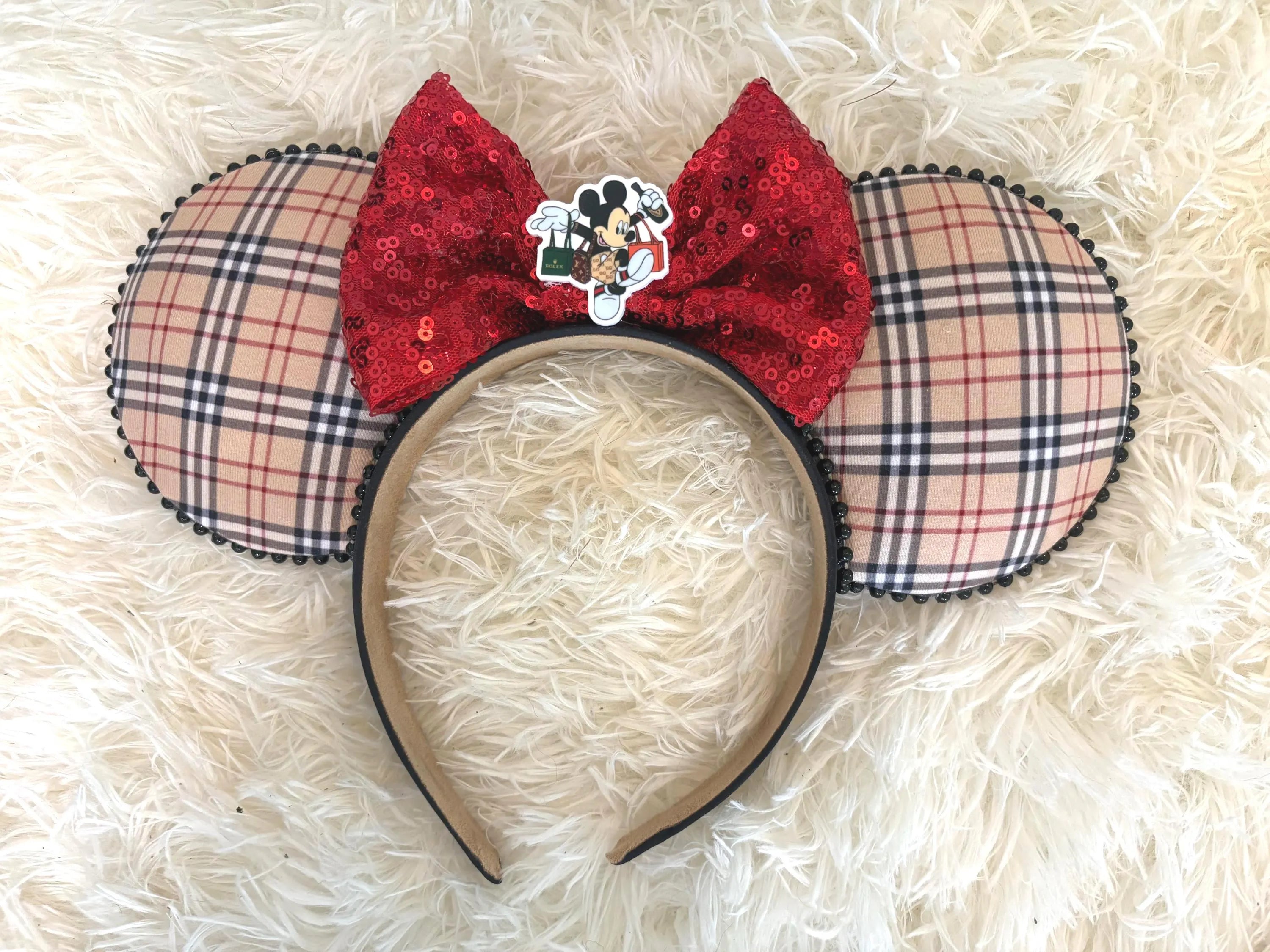 London Plaid Luxe Boutique Mouse Ear Headband featuring heritage-inspired plaid fabric, ruby red sequin bow, black pearl trim, and boutique styling by Pixie Park Company.