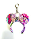 Handcrafted Mermaid Dreams mini ear keychain featuring ocean-inspired artwork, pastel satin bow with seashell accent, pearl trim, and silver clasp by Pixie Park Co.
