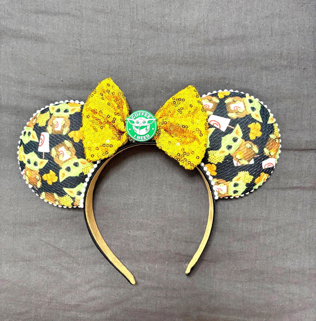 Morning Galaxy Adventure boutique mouse ear headband featuring galaxy-inspired character print, gold sequin bow, coffee-themed centerpiece and pearl trim.