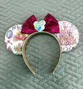 Enchanted Fairytale Boutique Mouse Ear Headband featuring fairytale castle, enchanted carriage, mirror and storybook-inspired artwork with a raspberry sequin bow.