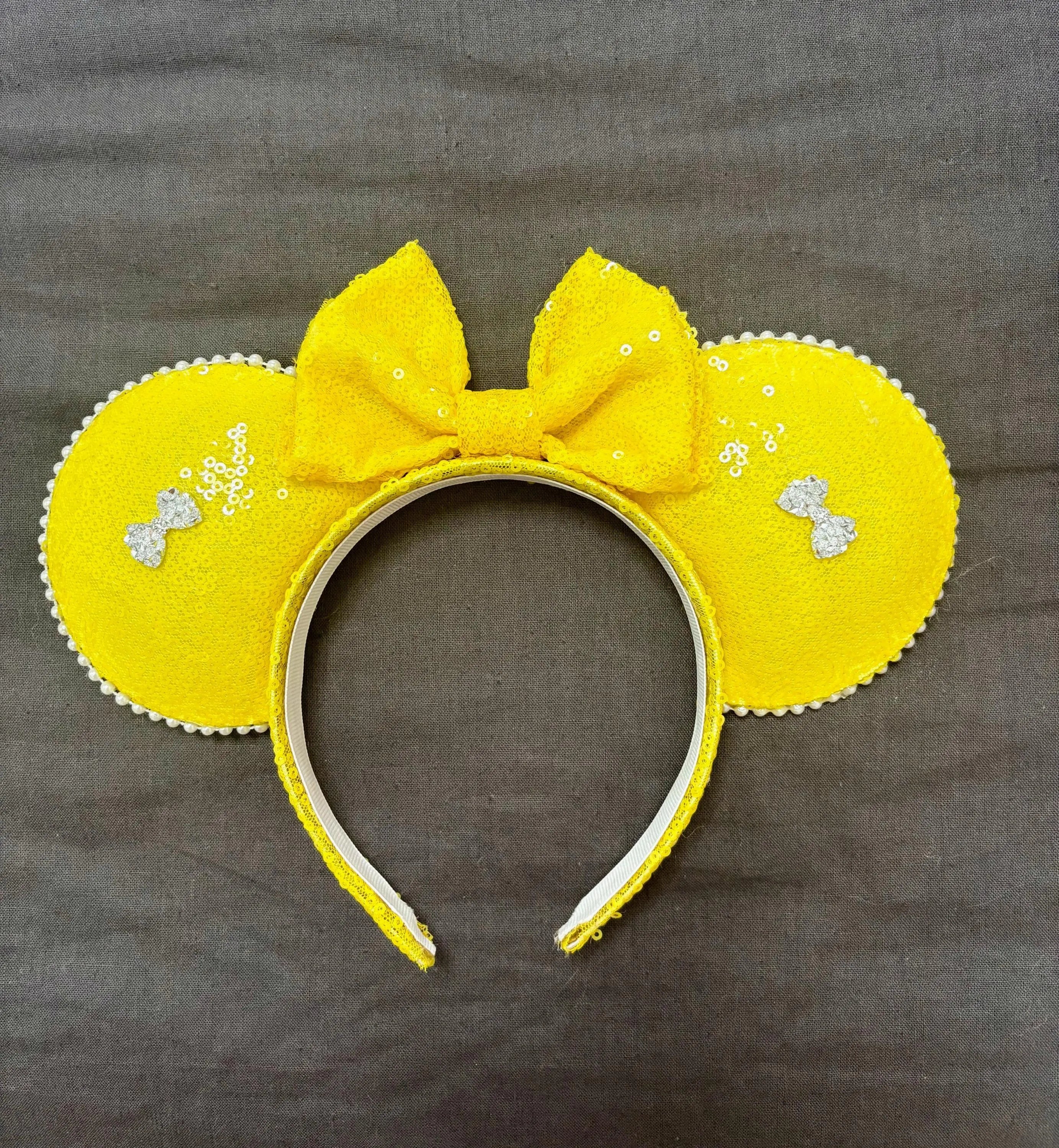 Handcrafted sunshine yellow boutique mouse ear headband featuring bright yellow sequined ears, matching bow, and sparkling crystal accents from Pixie Park Co.