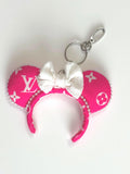 Handcrafted pink designer-inspired mini ear keychain with white bow, pearl trim, and silver clasp by Pixie Park Co