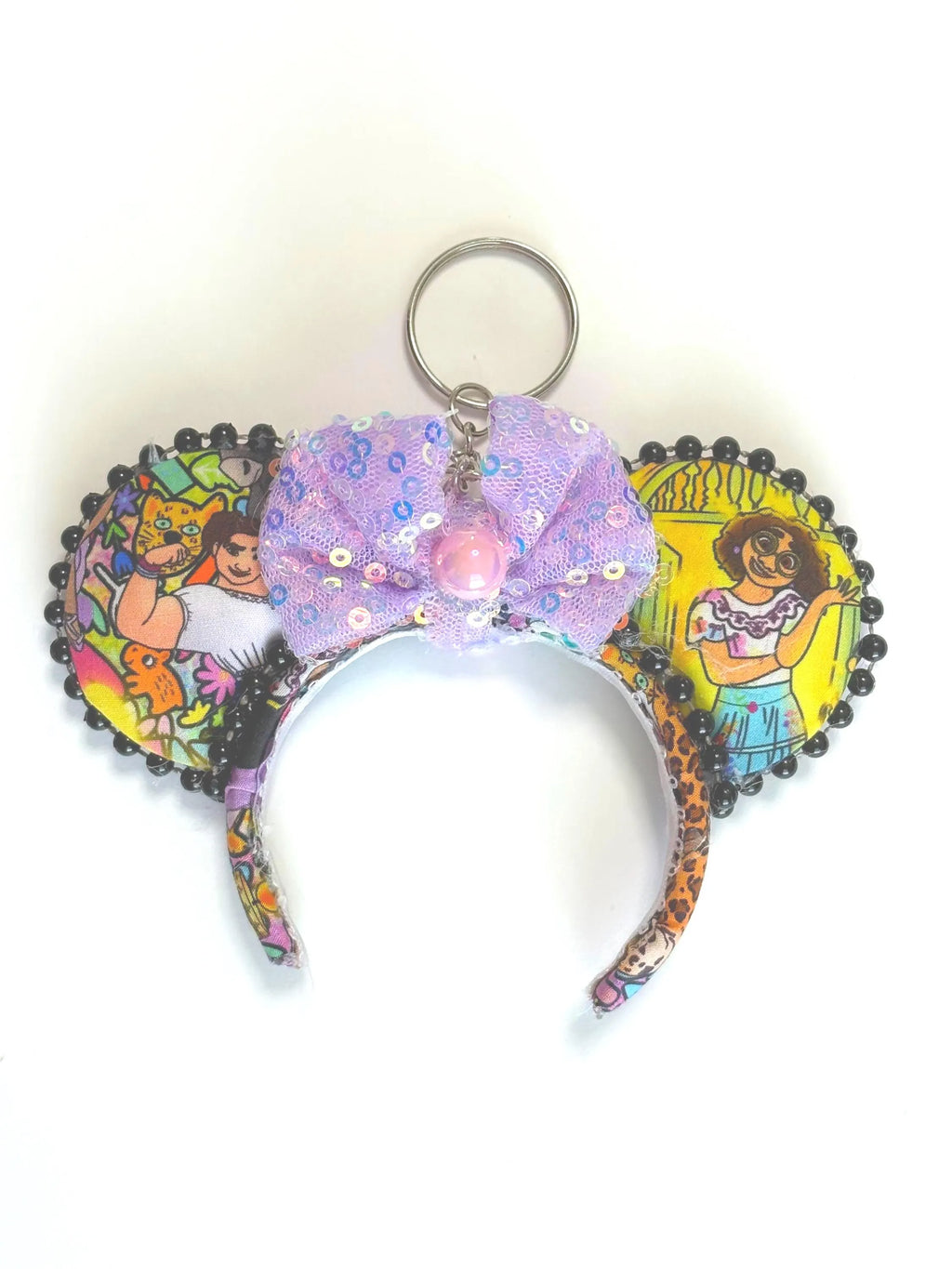 Handcrafted Casita Dreams mini ear keychain with colorful tropical-inspired artwork, lavender sequin bow, black pearl trim, and silver key ring by Pixie Park Co.