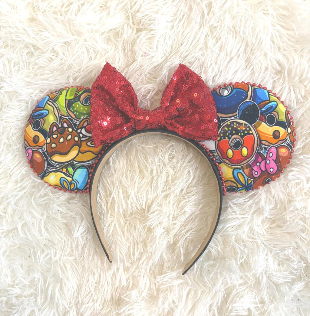 Park Pop handcrafted mouse ear headband featuring colorful abstract park-inspired icons with a sparkling red sequined bow from the Pixie Park Essentials Collection.