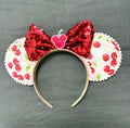 Handcrafted cherry-print boutique mouse ear headband with red sequined bow by Pixie Park Company.