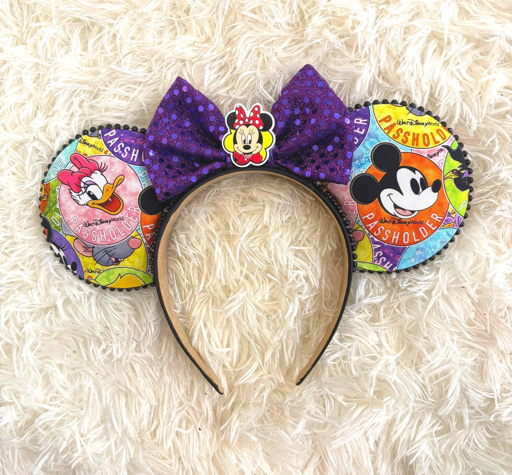 Park Insider Boutique Mouse Ear Headband with colorful park-inspired artwork, purple sequin bow, black pearl trim, and character centerpiece by Pixie Park Co.