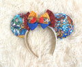 Toy Box Adventures Boutique Mouse Ear Headband featuring colorful toy-inspired artwork, a sequined boutique bow, and handcrafted boutique detailing.