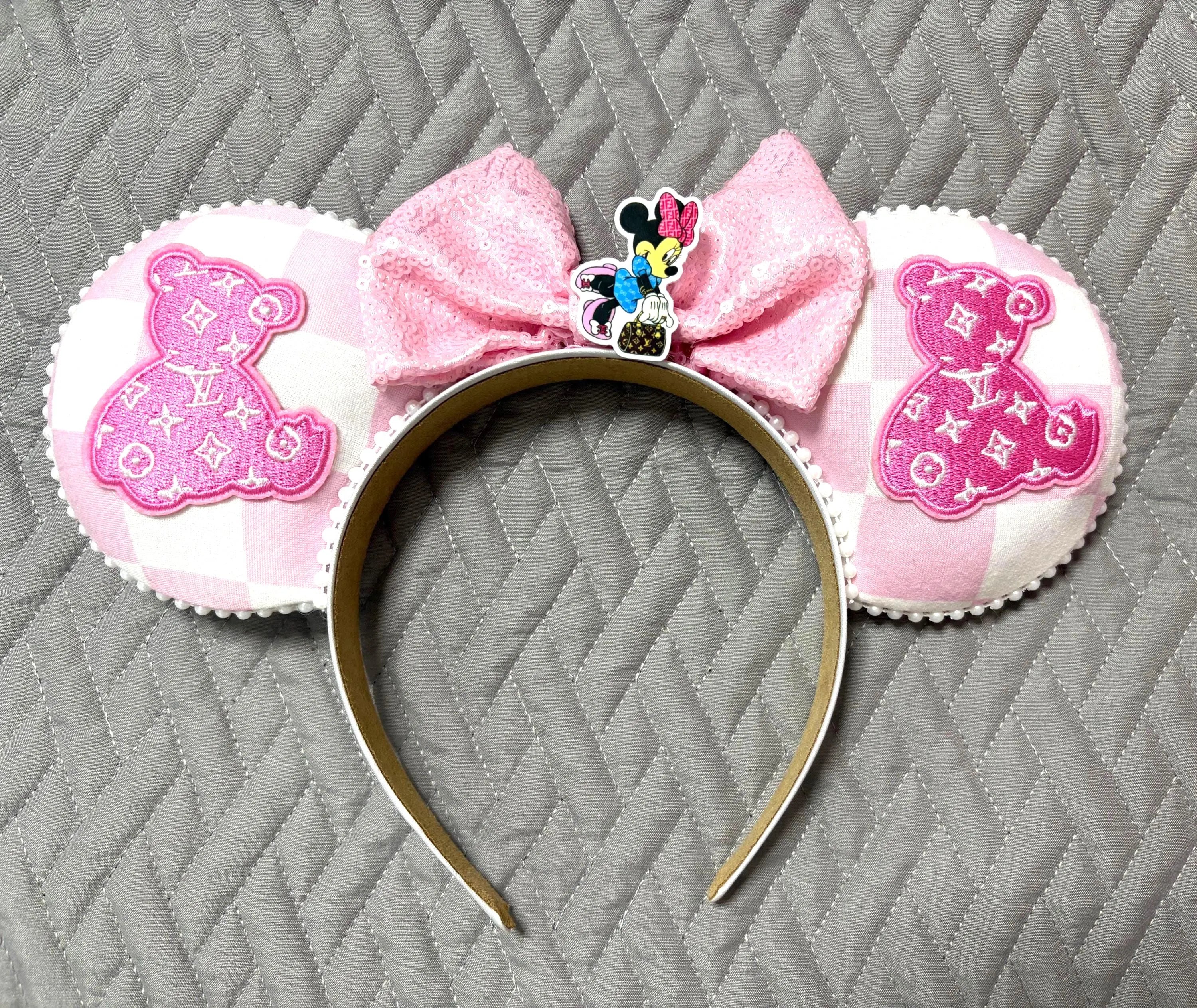 Handcrafted Blush Bear Boutique mouse ear headband featuring blush gingham designer-inspired fabric, embroidered teddy bear appliqués, pink sequin bow, pearl trim, decorative fashion-inspired mouse centerpiece, and lightweight comfort-fit headband.