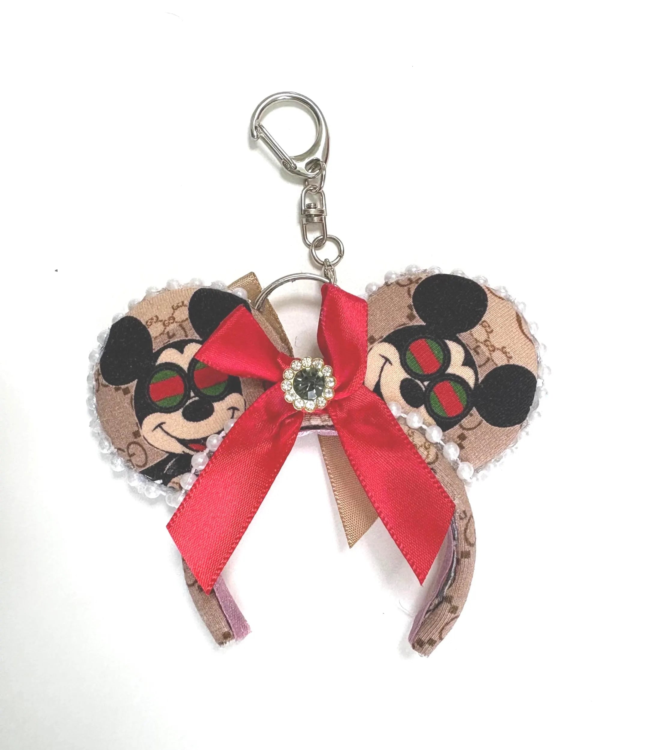 Espresso Chic Mini Ear Keychain and Bag Charm featuring boutique-inspired print, ruby red satin bow with crystal center, pearl trim, and handcrafted styling by Pixie Park Co.
