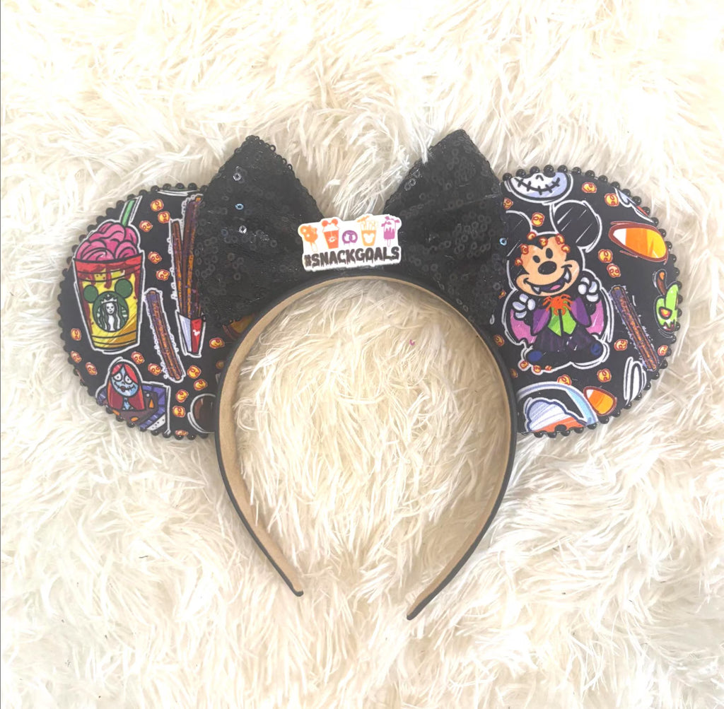 Pumpkin Park Spooktacular Boutique Mouse Ear Headband featuring Halloween-inspired artwork with pumpkins, festive treats, a sparkling black sequin bow, and handcrafted boutique detailing.