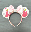Pink Princess Boutique Mouse Ear Headband from the Pixie Park Essentials Collection featuring classic storybook-inspired artwork, a soft pink satin bow with tiara accent, handcrafted styling, and lightweight comfort-fit design.