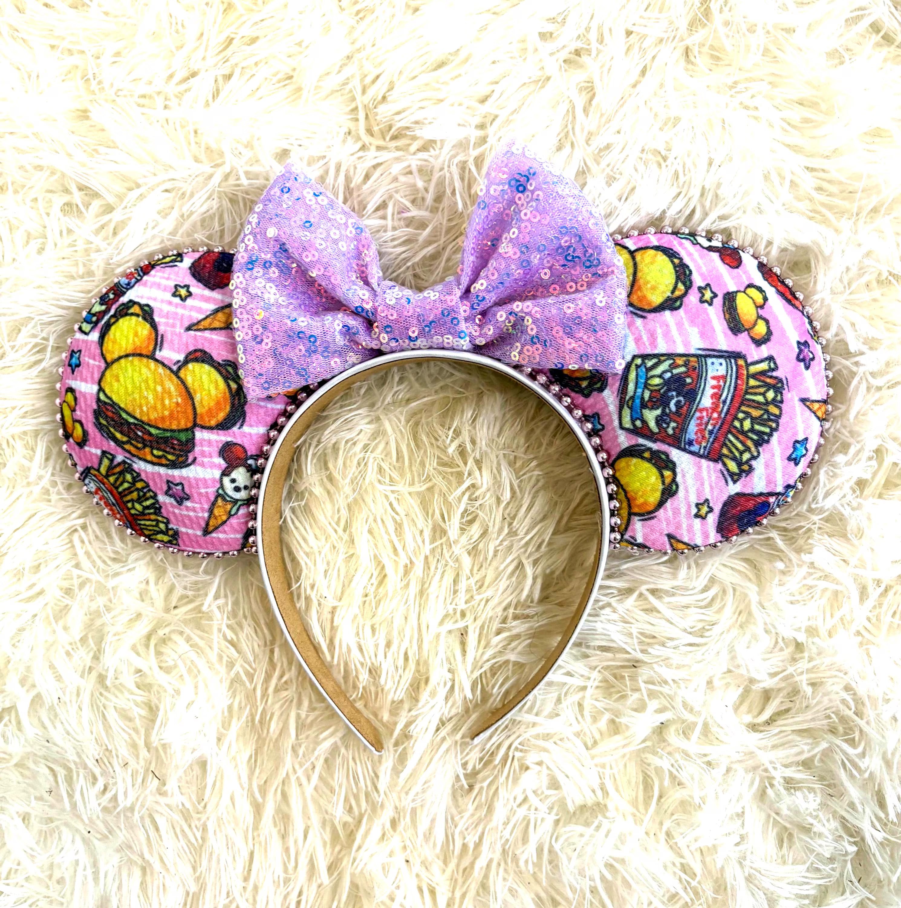 Handcrafted Park Treats Boutique Mouse Ear Headband from the Pixie Park Essentials Collection featuring colorful park snack-inspired artwork, a lavender sequin bow, and lightweight comfort for magical park adventures.