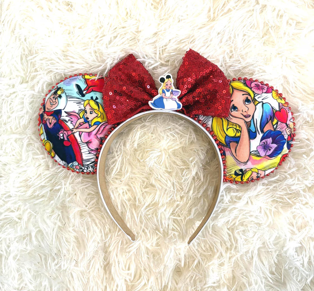 Wonderland Dreams Boutique Mouse Ear Headband featuring whimsical storybook-inspired artwork, ruby red sequin bow, handcrafted boutique styling, and comfort-fit headband by Pixie Park Company.