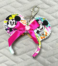 Handcrafted Park Day Mini Ear Keychain & Bag Charm featuring colorful park-inspired artwork, handcrafted floral centerpiece, pearl trim, ribbon accents, and silver swivel clasp.