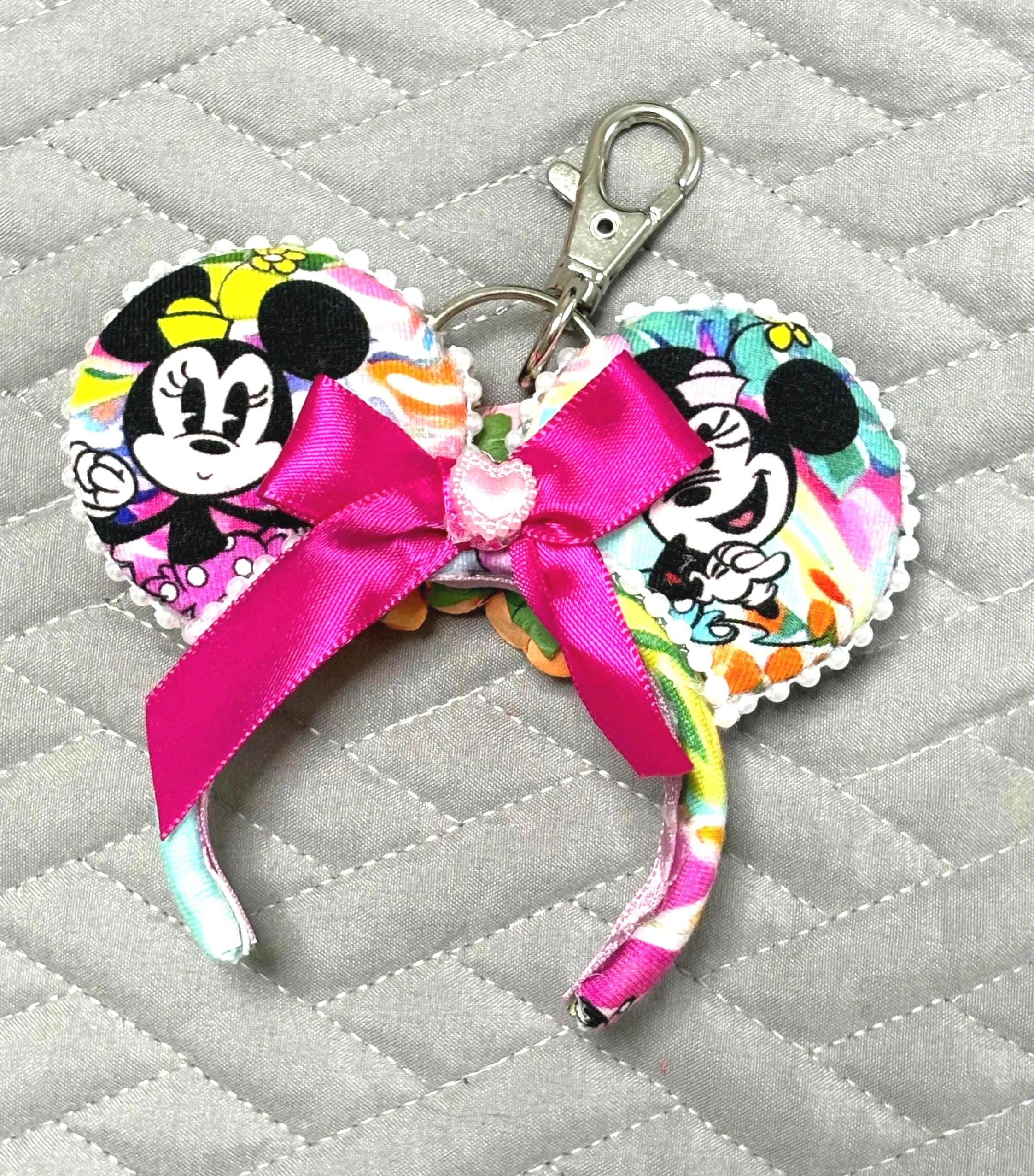 Handcrafted Park Day Mini Ear Keychain & Bag Charm featuring colorful park-inspired artwork, handcrafted floral centerpiece, pearl trim, ribbon accents, and silver swivel clasp.
