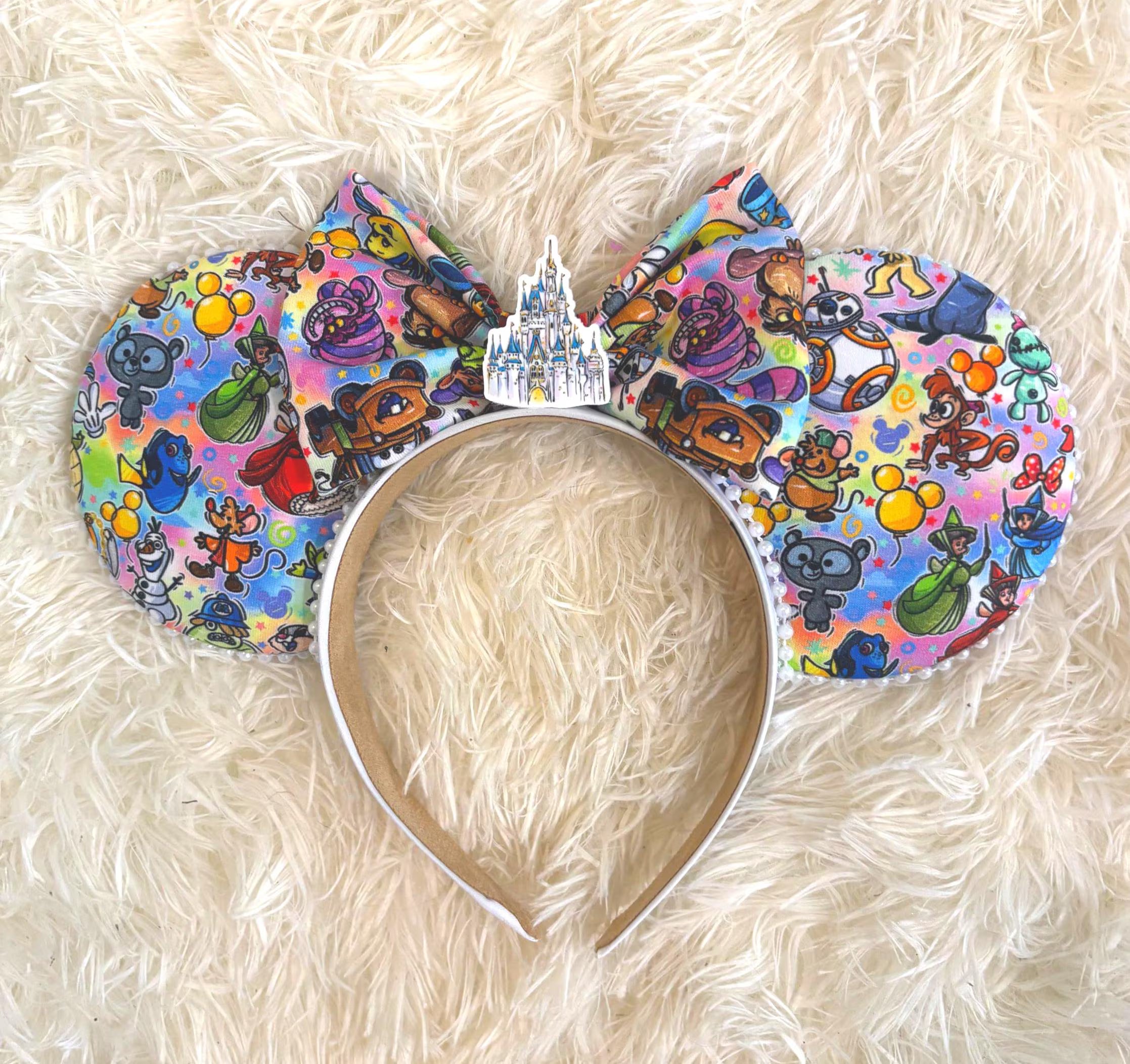 Park Celebration Boutique Mouse Ear Headband featuring a colorful park-inspired character collage, castle centerpiece, pearl trim, and handcrafted boutique styling by Pixie Park Co.