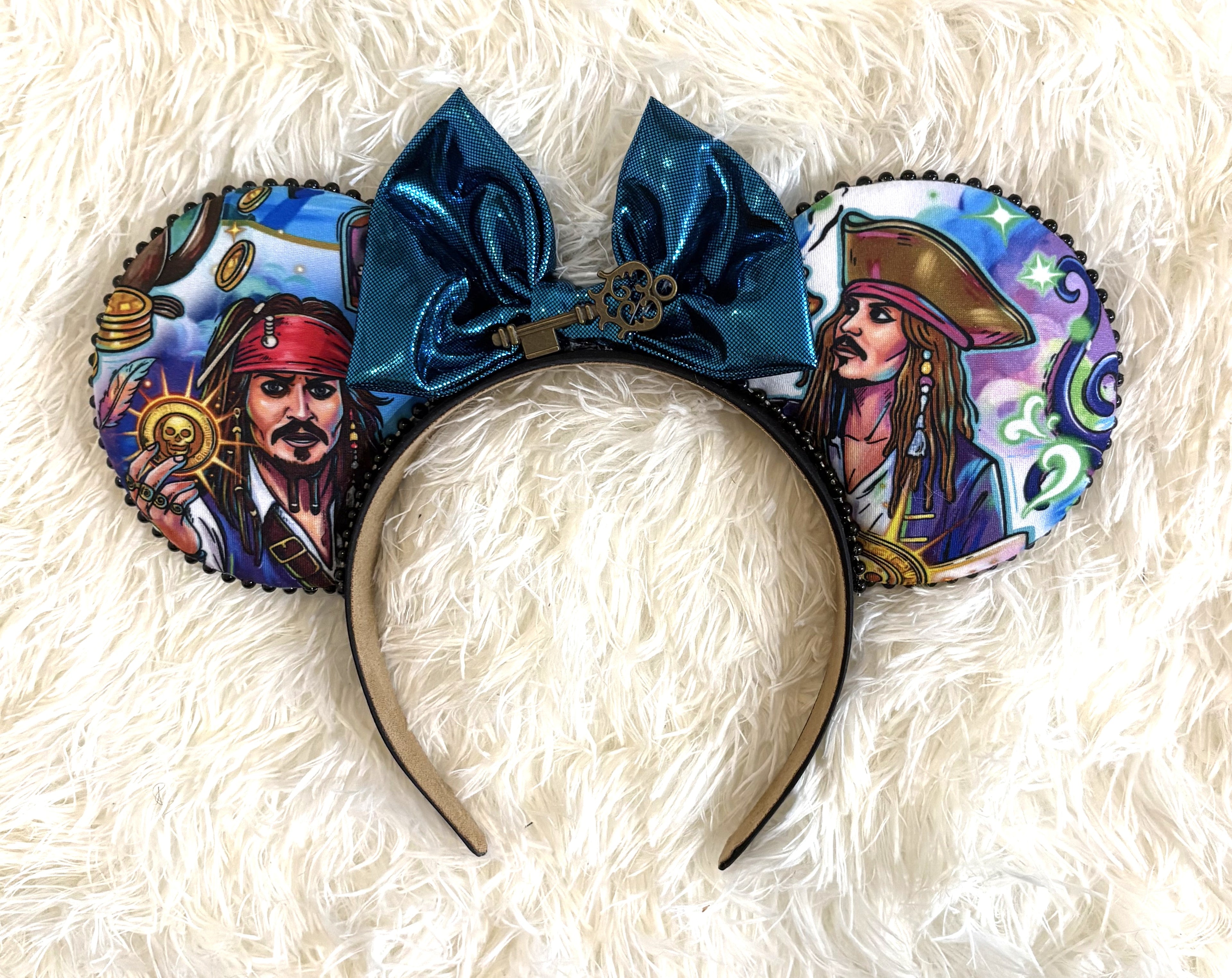 Handcrafted Skeleton Key Signature mouse ear headband featuring nautical-inspired artwork, a deep teal metallic bow, antique-style key centerpiece, decorative trim, and boutique craftsmanship by Pixie Park Company.