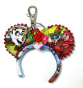 Handcrafted Holiday Magic Mini Magic Charm featuring festive holiday-inspired artwork with a gold-tone key ring, perfect for bags, backpacks, purses, and magical seasonal adventures.