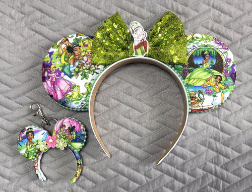 Handcrafted Bayou Blossom Pixie Pair featuring a boutique mouse ear headband with a matching Mini Magic Charm in elegant floral bayou-inspired green and gold styling.