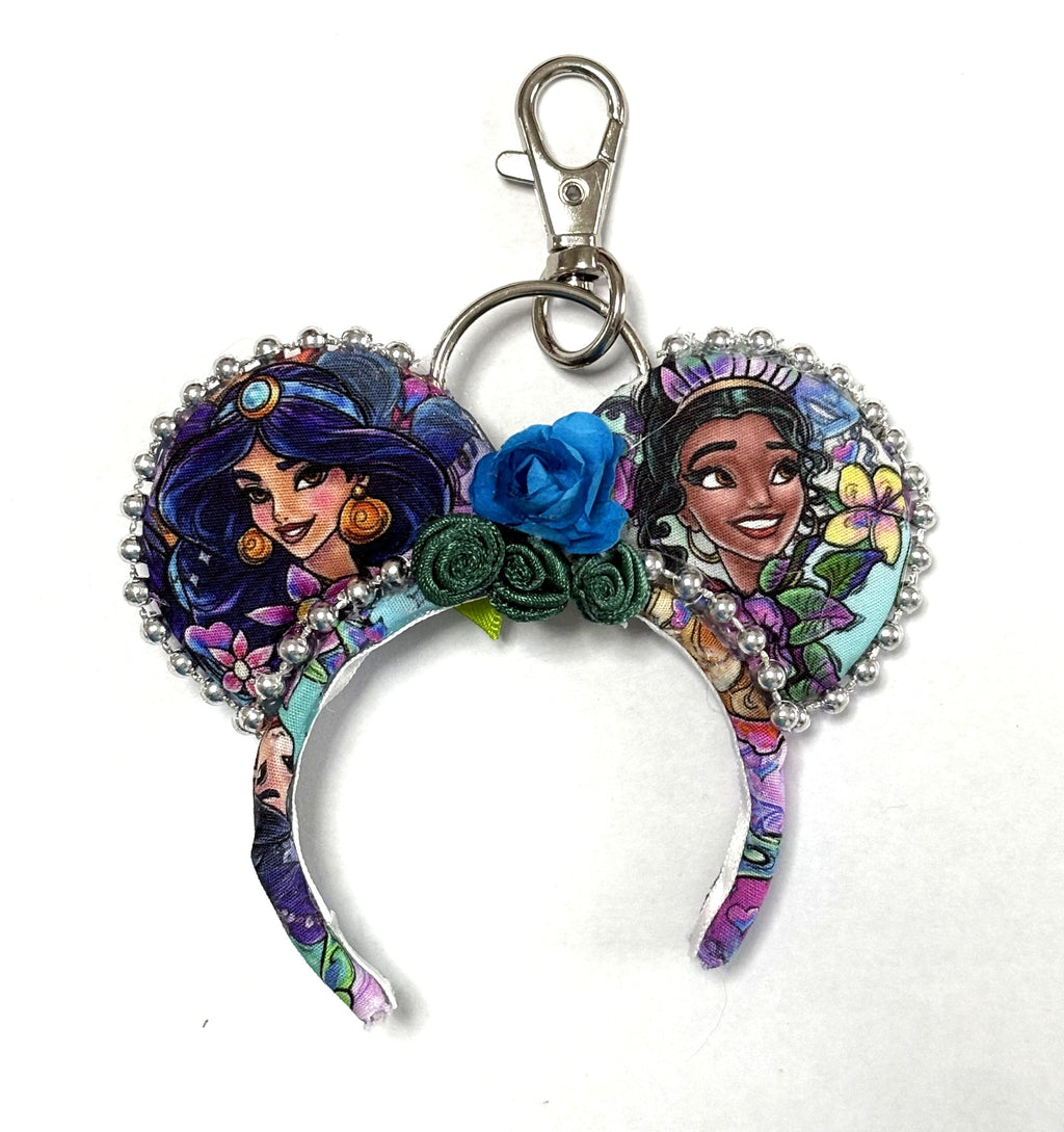 Handcrafted Bayou & Bazaar Mini Magic Charm from the Princess Duos Collection featuring elegant boutique styling inspired by a magical bayou and an enchanting marketplace with a gold-tone key ring.