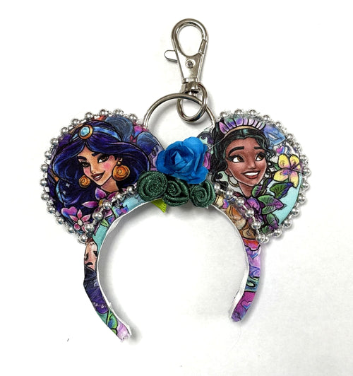 Handcrafted Bayou & Bazaar Mini Magic Charm from the Princess Duos Collection featuring elegant boutique styling inspired by a magical bayou and an enchanting marketplace with a gold-tone key ring.