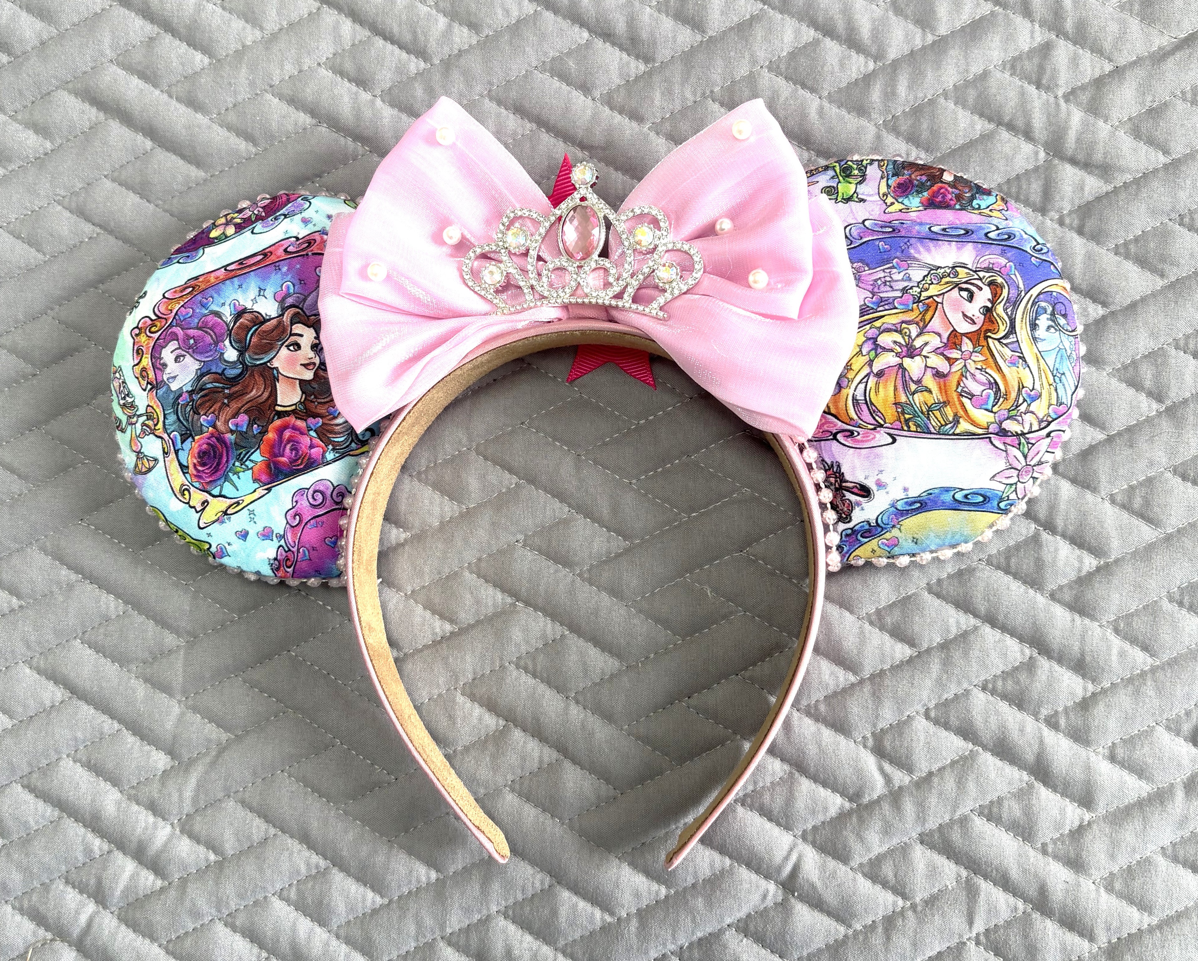 Handcrafted Tower & Rose – Princess Duos Signature mouse ear headband featuring elegant boutique styling inspired by a fairy tale tower and an enchanted rose with handcrafted layered details.