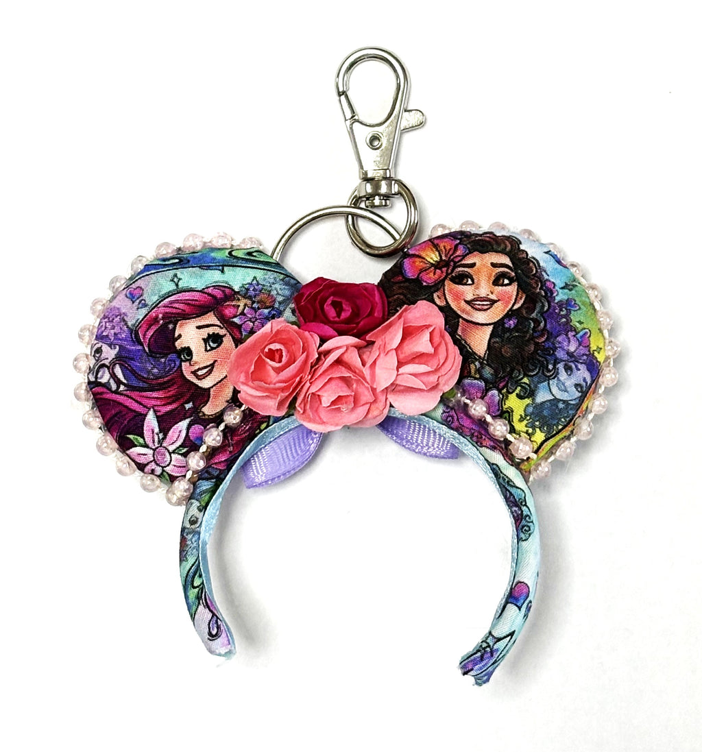 Handcrafted Isles & Oceans – Princess Duos Mini Magic Charm featuring elegant boutique styling inspired by tropical islands and enchanting ocean adventures with a gold-tone key ring.