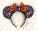 Handcrafted Halloween mouse ear headband featuring colorful seasonal artwork, a sparkling orange sequined bow, witch-hat centerpiece, and boutique beaded trim by Pixie Park Co.
