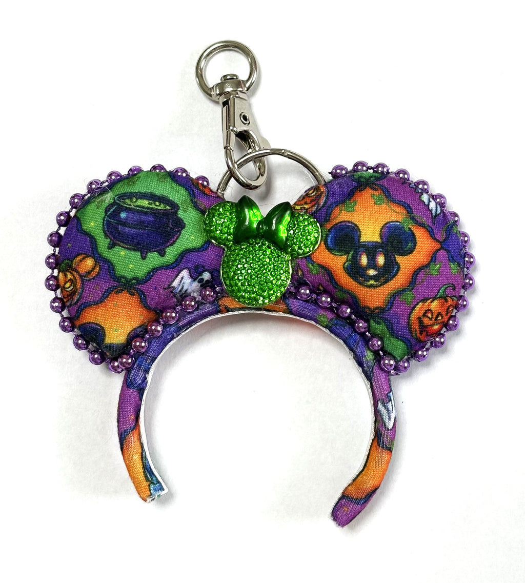 Handcrafted Hallow Wishes Mini Magic Charm featuring festive Halloween artwork, a sparkling orange sequined bow, and boutique styling by Pixie Park Co.