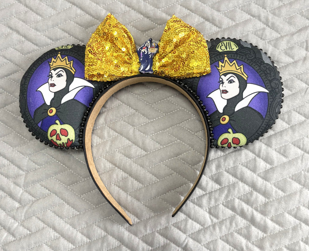 Handcrafted fairy tale queen-inspired Signature mouse ear headband featuring regal artwork, a rich purple sequined bow, boutique detailing, and a lightweight comfort-fit design for Halloween and magical park adventures.