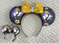 Handcrafted Royal Enchantment Pixie Pair featuring coordinated fairy tale-inspired accessories with elegant purple accents, boutique detailing, and secure clasps for backpacks, purses, keychains, and park bags.