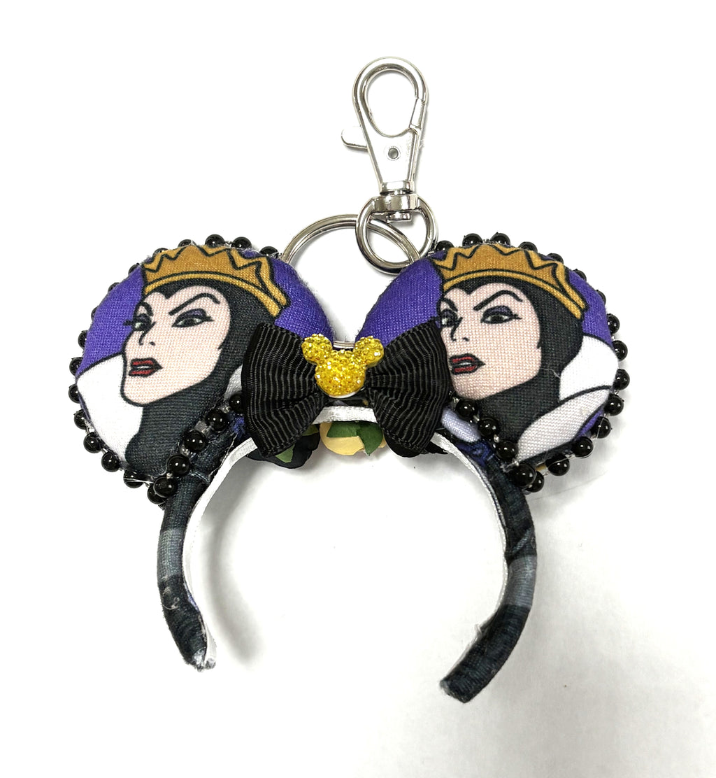 Handcrafted Royal Enchantment Mini Magic Charm featuring regal fairy tale-inspired artwork, elegant purple accents, boutique detailing, and a secure clasp for backpacks, purses, keys, and park bags.