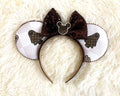 Handcrafted Haunted Couture Signature mouse ear headband featuring luxury-inspired ghost-themed fabric, a bronze sequined bow, elegant beaded trim, and boutique craftsmanship for Halloween and autumn park adventures.