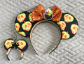 Poison Apple Brew  Pixie Pair featuring a handcrafted Halloween mouse ear headband and matching Mini Magic Charm with bright poison-apple-inspired print and spooky seasonal details.
