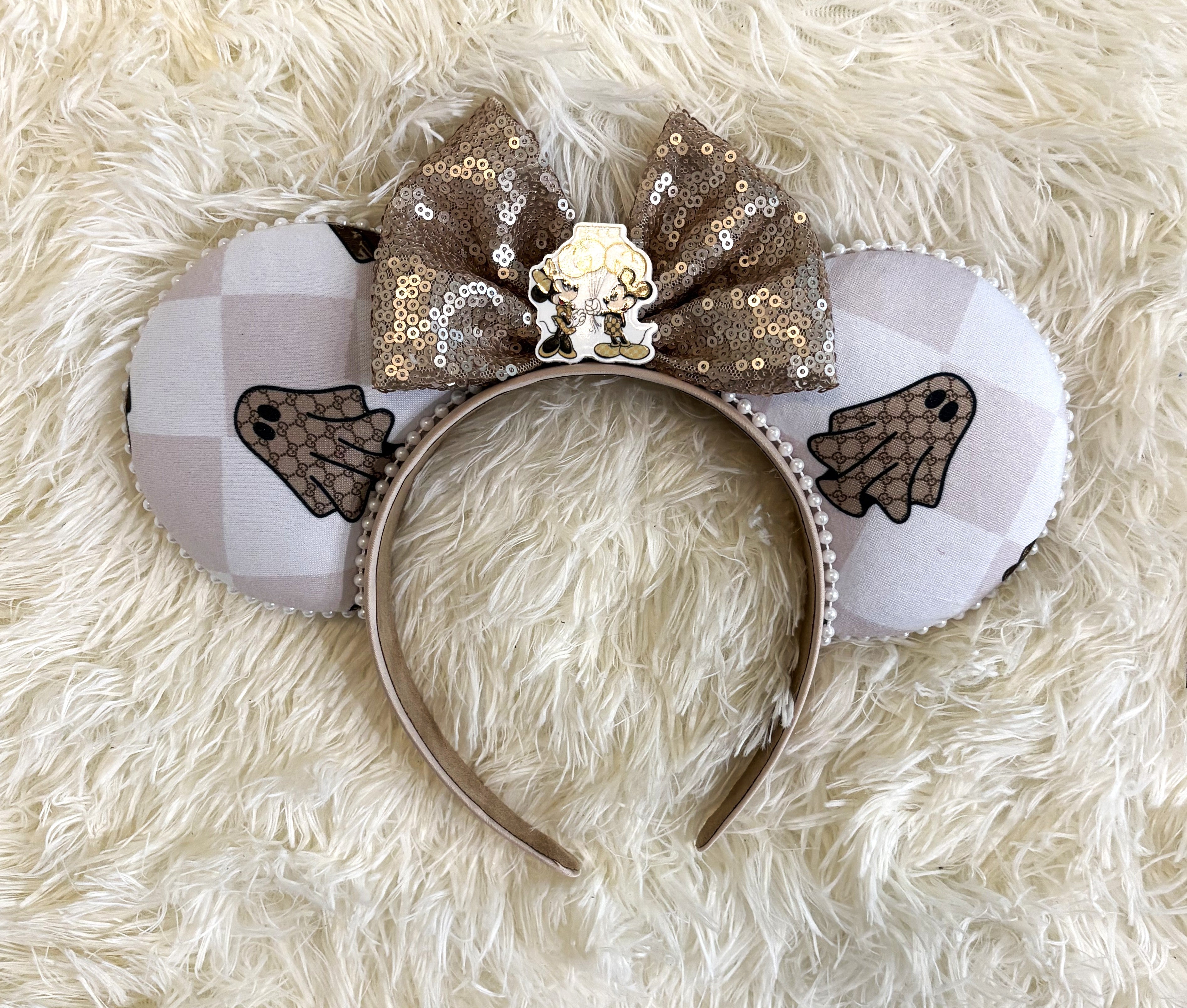 Ghostly Glamor handcrafted Halloween mouse ear headband featuring neutral ghost-inspired fabric, champagne sequin bow and delicate pearl trim.