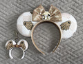 Ghostly Glamor Pixie Pair featuring a handcrafted neutral Halloween mouse ear headband and matching Mini Magic Charm with ghost-inspired details, champagne accents and pearl trim.
