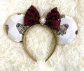 Haunted Elegance handcrafted Halloween mouse ear headband featuring designer-inspired ghost patterns, burgundy sequin bow, gold beaded trim and pearl-style jeweled centerpiece.