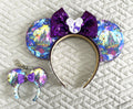Midnight Kingdom Pixie Pair featuring a handcrafted Halloween castle-themed mouse ear headband and matching Mini Magic Charm with pumpkins, ghosts and sparkling purple details.