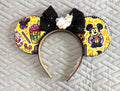 Spooky Treats  handcrafted Halloween mouse ear headband featuring colorful candy, pumpkins and seasonal treat imagery with a sparkling black sequin bow and black beaded trim.