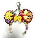 Honey Bear & Friends handcrafted mini ear charm featuring colorful honey-bear and woodland-friend imagery, red and yellow bow, beaded trim, lobster clasp and split ring.