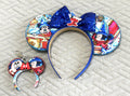 Sorcerer’s Spell Pixie Pair featuring a handcrafted sorcerer-inspired mouse ear headband with royal-blue sequin bow and matching Mini Magic Charm.
