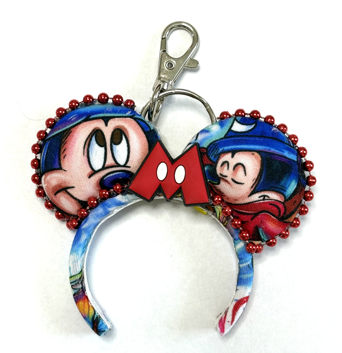 Sorcerer’s Spell handcrafted mini ear charm featuring colorful sorcerer-inspired imagery, red and blue details, coordinating bow, beaded trim, lobster clasp and split ring.