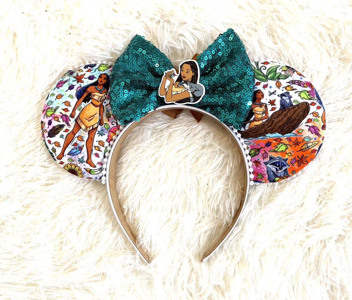 Spirit of the River handcrafted mouse ear headband featuring colorful woodland and river-inspired imagery, autumn leaves, emerald-green sequin bow and white beaded trim.