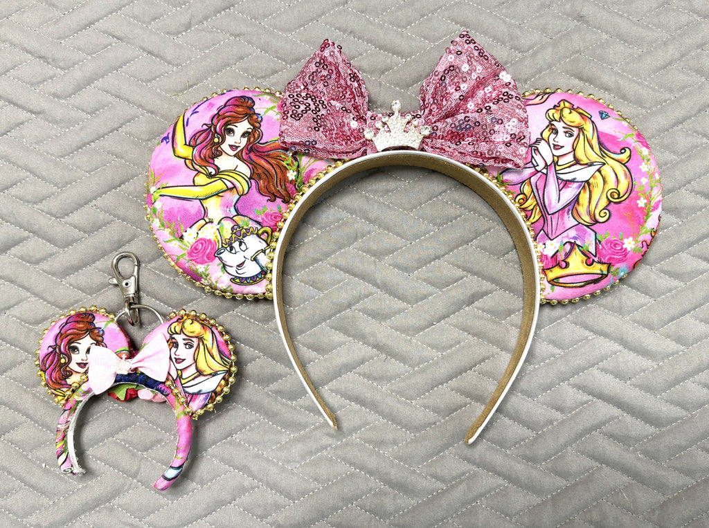Enchanted Rose Princess Duo Pixie Pair with handcrafted pink princess-inspired mouse ear headband, sparkling bow and crown, plus matching Mini Magic Charm.