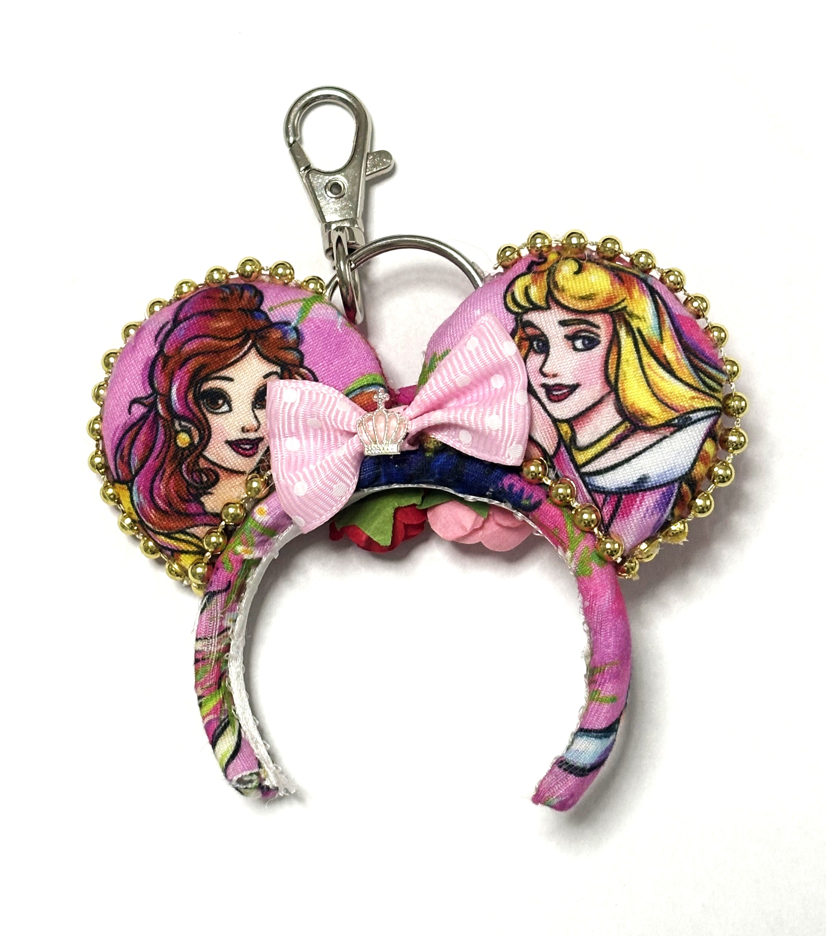 Handcrafted Enchanted Rose Princess Duo Mini Magic Charm featuring two pink princess-inspired mini ears, gold trim, soft pink bow, and lobster clasp.