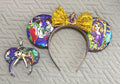 Golden Tower Pixie Pair with handcrafted purple princess-inspired mouse ear headband, sparkling gold bow and matching Mini Magic Charm.
