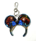 Handcrafted Highland Destiny Mini Magic Charm with Scottish-inspired storybook ears, blue beaded trim, bright-blue polka-dot bow and lobster clasp.