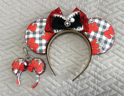 Cherry Belle Pixie Pair with handcrafted black-and-white gingham cherry mouse ear headband, red sequin bow and matching Mini Magic Charm.