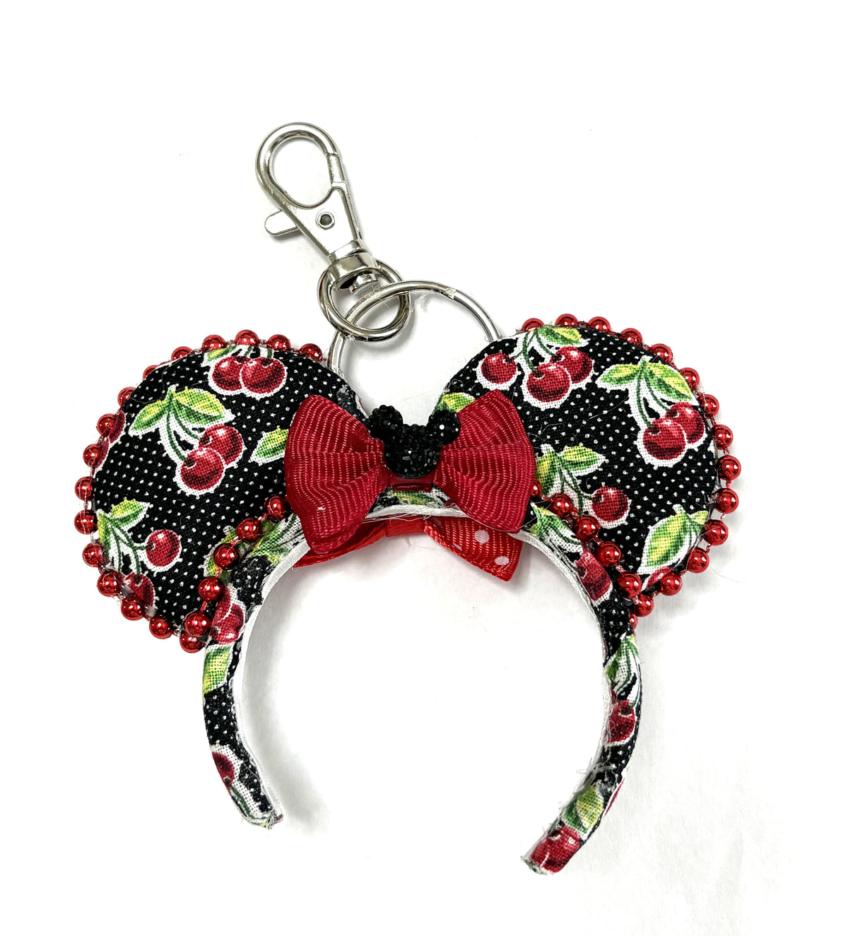 Handcrafted Midnight Cherry Mini Magic Charm with black cherry-print ears, sparkling red beaded trim, red bow and silver-tone lobster clasp.